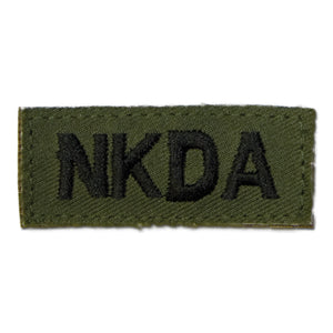 Insigne tissu NKDA auto-agrippant